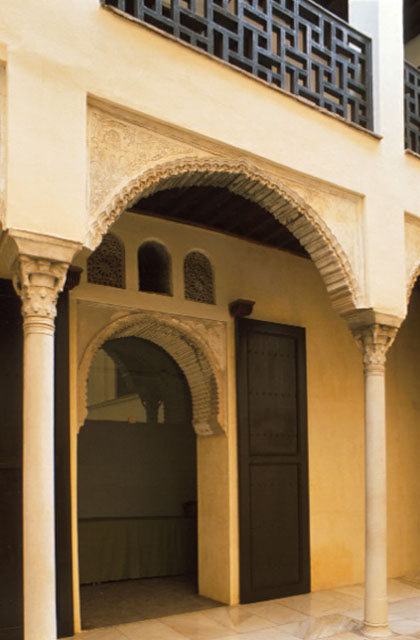 The slim columns, rounded arches and geometric ornamentation are characteristic of Arab Nasrid design