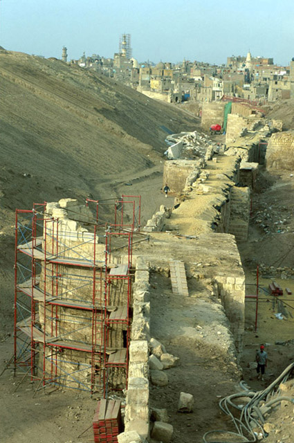 Elevated view looking south across the top of the wall during conservation. Construction site of al-Azhar Park appears at left
