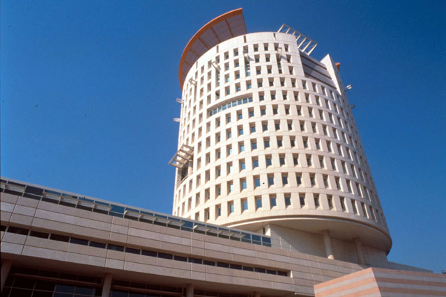 National Chamber of Commerce and Industry - Exterior view showing pierced windows of cylindrical tower