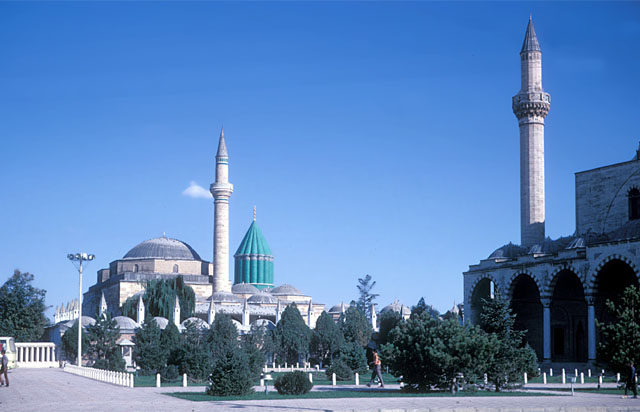 General view from northeast showing dervish cells with chimneys before mosque and shrine. The portico of the Selimiye Mosque appears in the right foreground