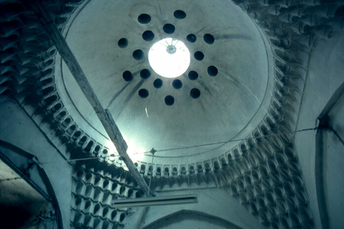 Interior detail from Meyhaneli Hamam showing muqarnas pendentives and oculus on dome