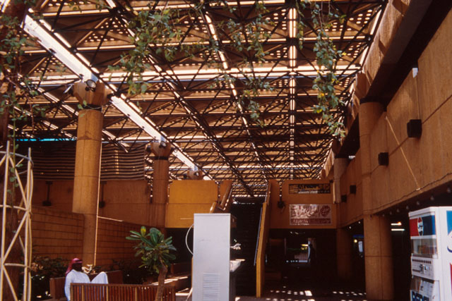 Interior view showing lattice roof and seating areas in central covered courtyard