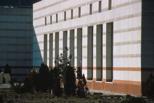 ATK Textile Factory - Exterior view showing concrete façade with elongated vertical window shafts