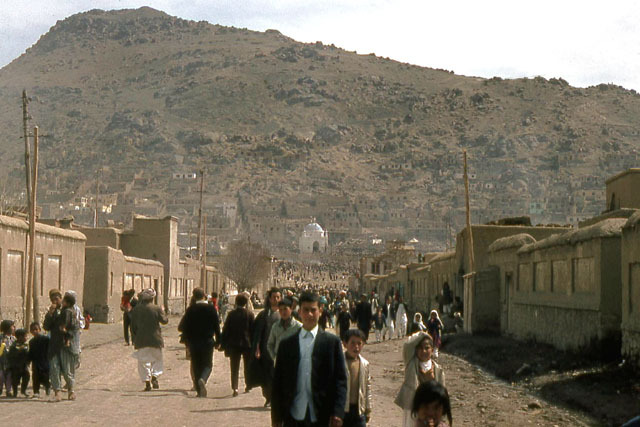 Distant view showing residential street leading to shrine, during Nauroz celebrations