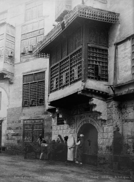 Historic view,  residence of Ahmad Katkhuda al-Razzaz on the Bab al-Wazir, ca. 1870.  The mashrabiyya projects over the entrance
