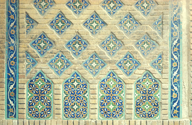 Detail of diamond patterned brickwork inlaid with tile mosaic, intrados of southeast iwan