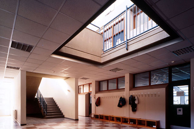 Interior view showing foyer and stairwell to classrooms
