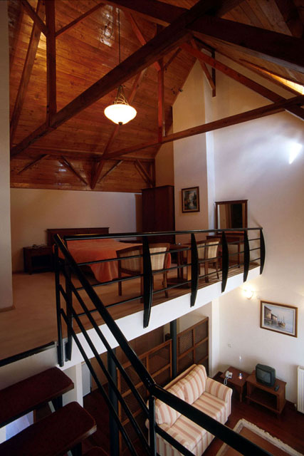Interior view showing wooden cross-beams in loft