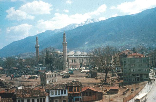 Exterior view from northwest, showing residential quarter of neighborhood demolished following the fire of 1957 and the Great Mosque at center