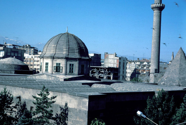 Elevated view from north showing mosque roofscape as restored in the nineteenth century. From left to right, the qibla dome, courtyard dome, minaret and the tomb dome