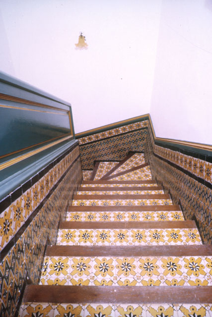 Interior detail showing mix of tile in staircase