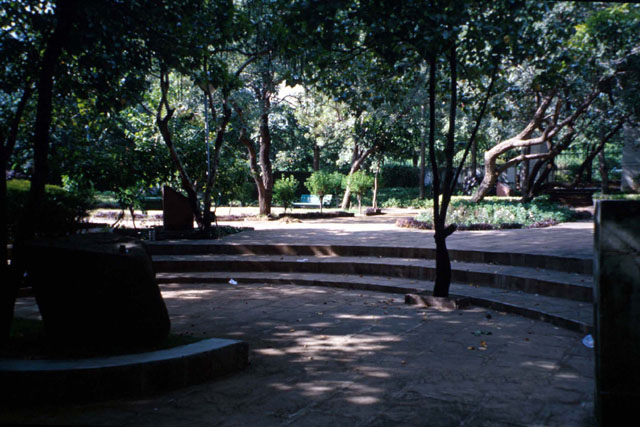 Exterior view showing shaded, paved resting space