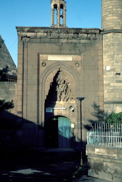Exterior view; mosque portal and minaret shaft