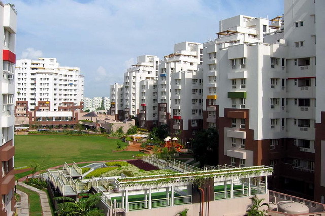 Udita apartment blocks and central green space, view looking east towards Club de Ville