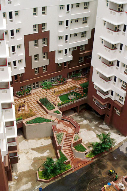 Elevated view of an Udita apartment block, showing landscaped entry court