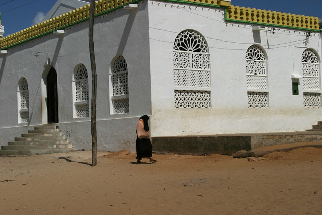 Street view of latticed arches in mosque façade