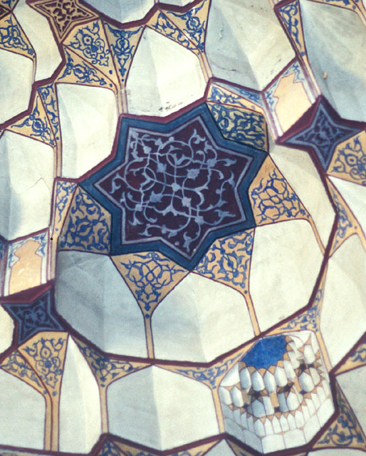Courtyard detail of entrance iwan; muqarnas hood with painted and carved arabesques