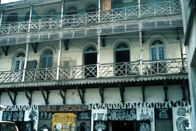 Historic residence with wooden balconies and shop (Anil's Arcade) on ground floor