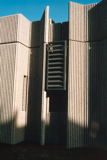 Exterior view showing corrugated concrete façade