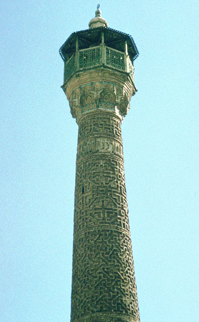 Detail of minaret, showing upper trunk with balcony and canopy
