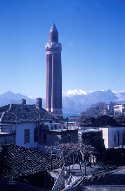Exterior view from northeast, showing minaret and mosque domes with Antalya bay seen in the background