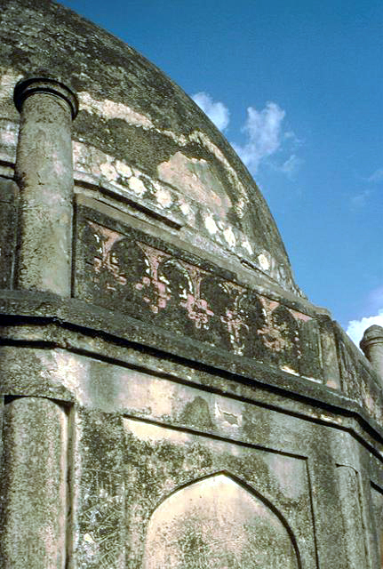 Exterior close-up of dome and stone carving on façade