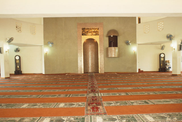Interior view in prayer hall showing mihrab on qibla wall