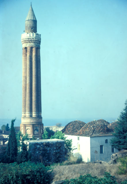 Exterior view from northeast, showing minaret and mosque with Antalya bay seen in the background