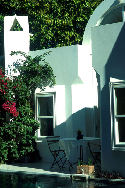Berk Residence - Exterior detail showing bougainvillea against white washed façade