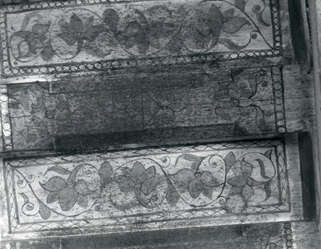 Interior detail; painted floral patterns on wooden ceiling beams