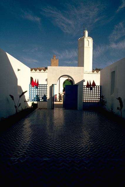 View toward the gates of the center with the minaret of the mosque in the background