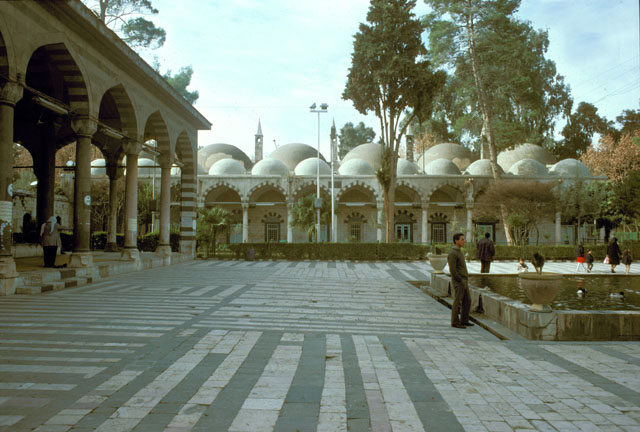 Courtyard view showing domed hospice rooms and mosque portico (left)