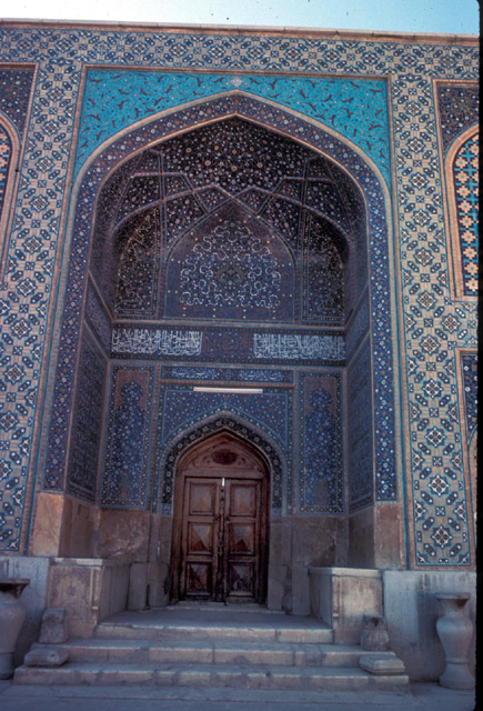 Southwest facade of northeast courtyard, view of iwan in portal leading to madrasa.