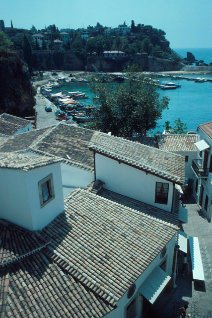 Elevated view across  clay rooftops to harbor
