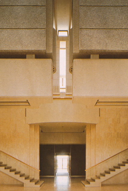 Interior detail showing entrance and staircases to upper levels with central dramatic light source