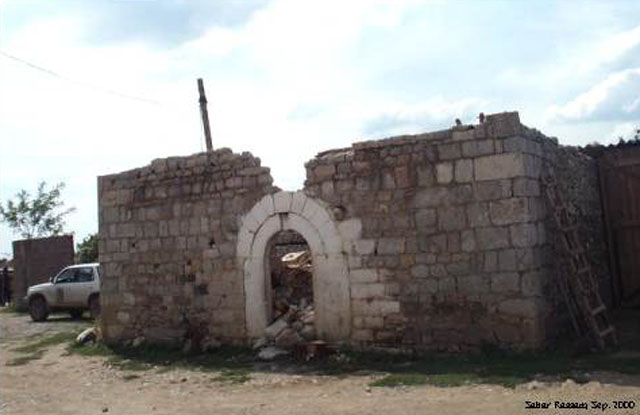 Ruined outer wall and front façade
