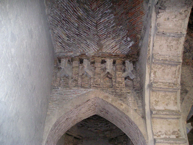 Interior view, looking up at vault resting on brackets