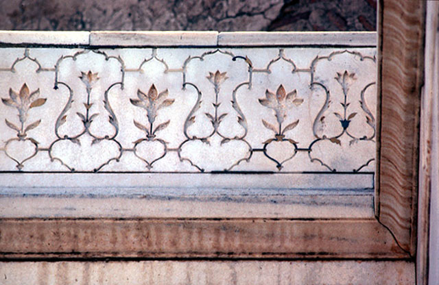 Exterior detailed view of frieze on top of main portal