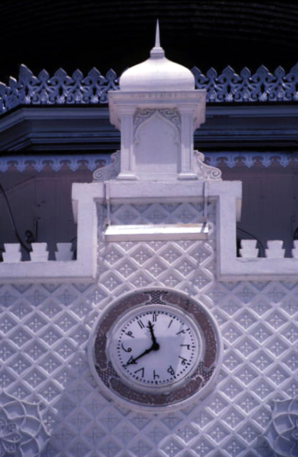 Detail of clock on main façade with Arabic numerals