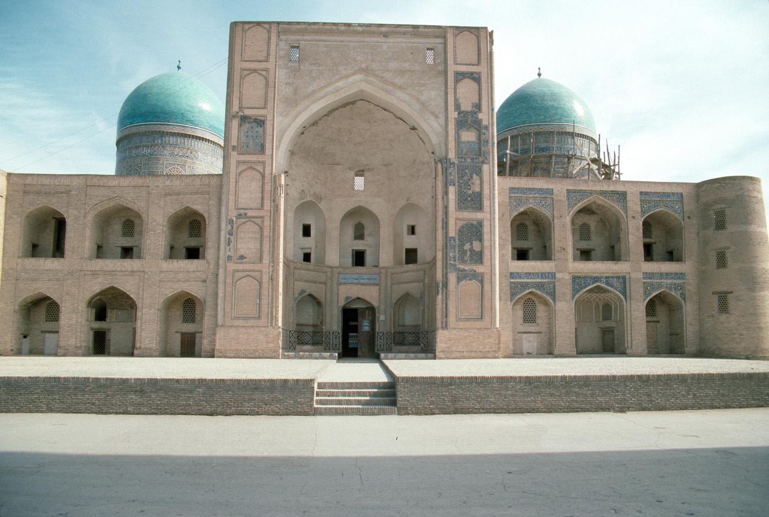 Exterior view of the west (main) façade with entrance pishtaq and domes beyond