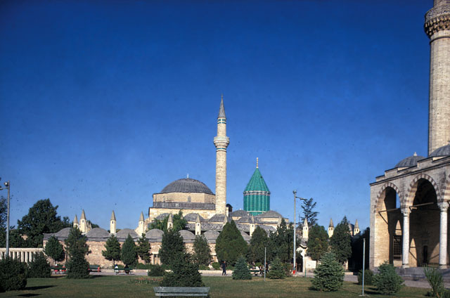 General view from north, showing dervish cells with chimneys before mosque and shrine. The portico of the Selimiye Mosque appears in the right foreground