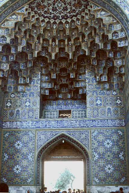 Imam Reza Shrine Complex: Sahn-e Engelab - Detail view of the rear of the western iwan, with muqarnas half-dome