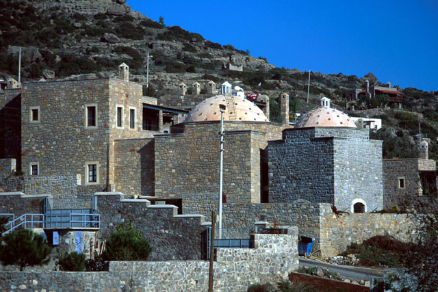Exterior view showing stone façades and pierced domes