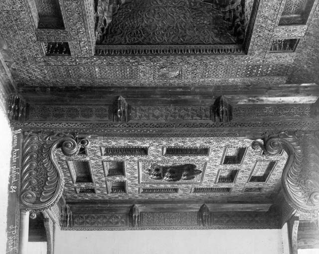 Historic interior. Detail of carved wooden ceiling ornament