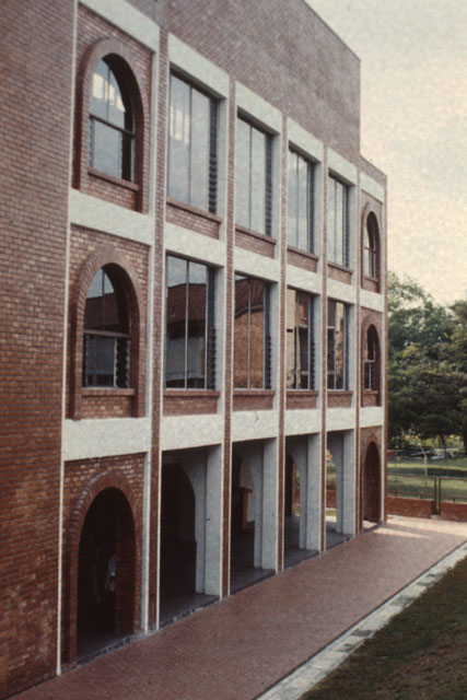 Exterior view showing enclosed balconies