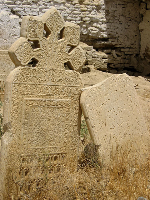 Decorated marble headstones in graveyard, south of community mosque