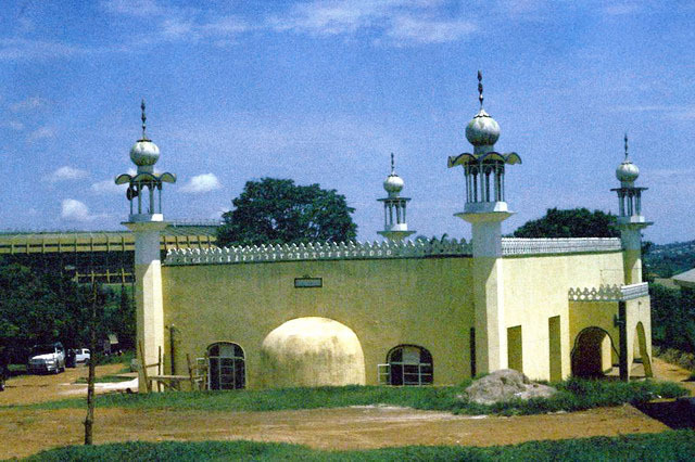 Exterior view, qibla wall with mihrab apse, and secondary men's entrance