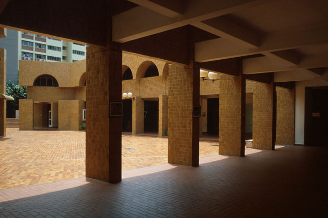 View from covered aisles showing outdoor courtyard