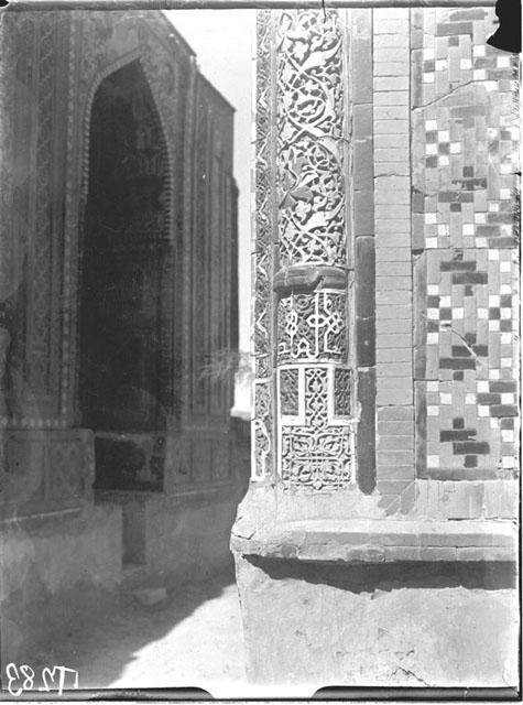 Engaged corner column of the entry portal. The Shad-i Mulk Aqa mausoleum stands beyond