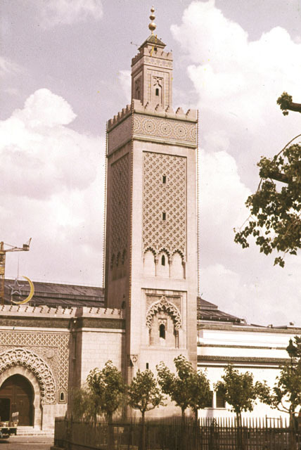Exterior view of western façade with gate and minaret